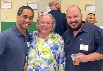 People posing for photo at event
